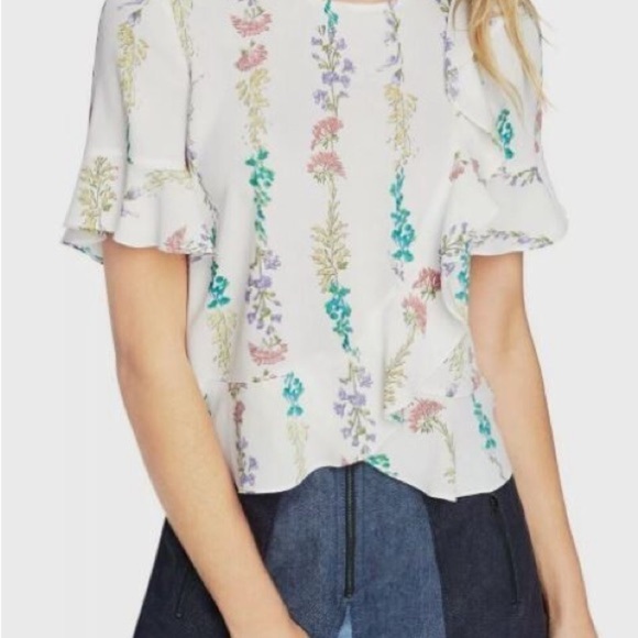 BCBGMaxAzria Tops - BCBGMaxAzria White Flutter Sleeve Blouse with Ruffled Details
